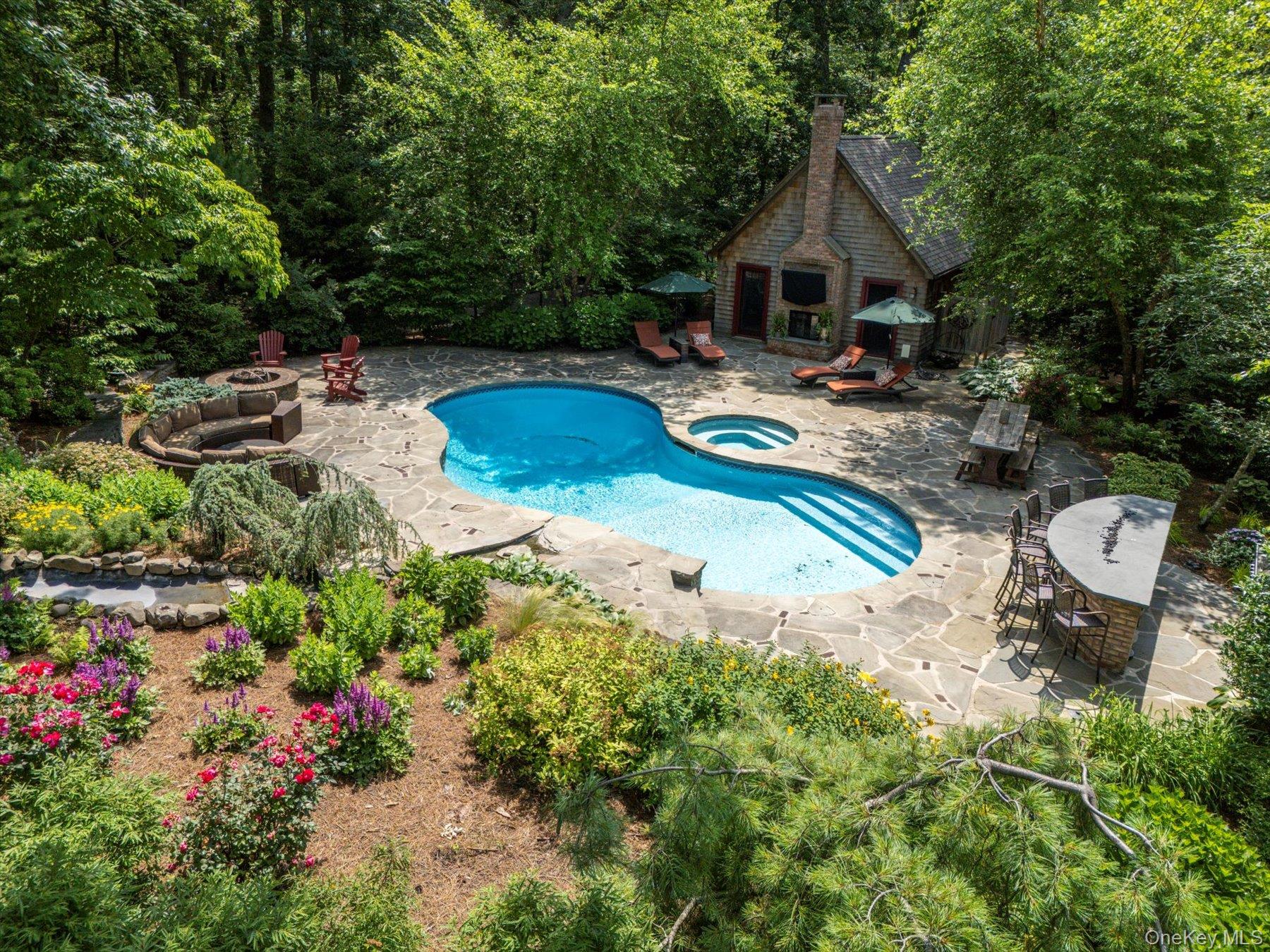 1750 Private Road, Unit 18 Mattituck, NY 11952 - Photo 34 of 49 a aerial view of a house with swimming pool and sitting area