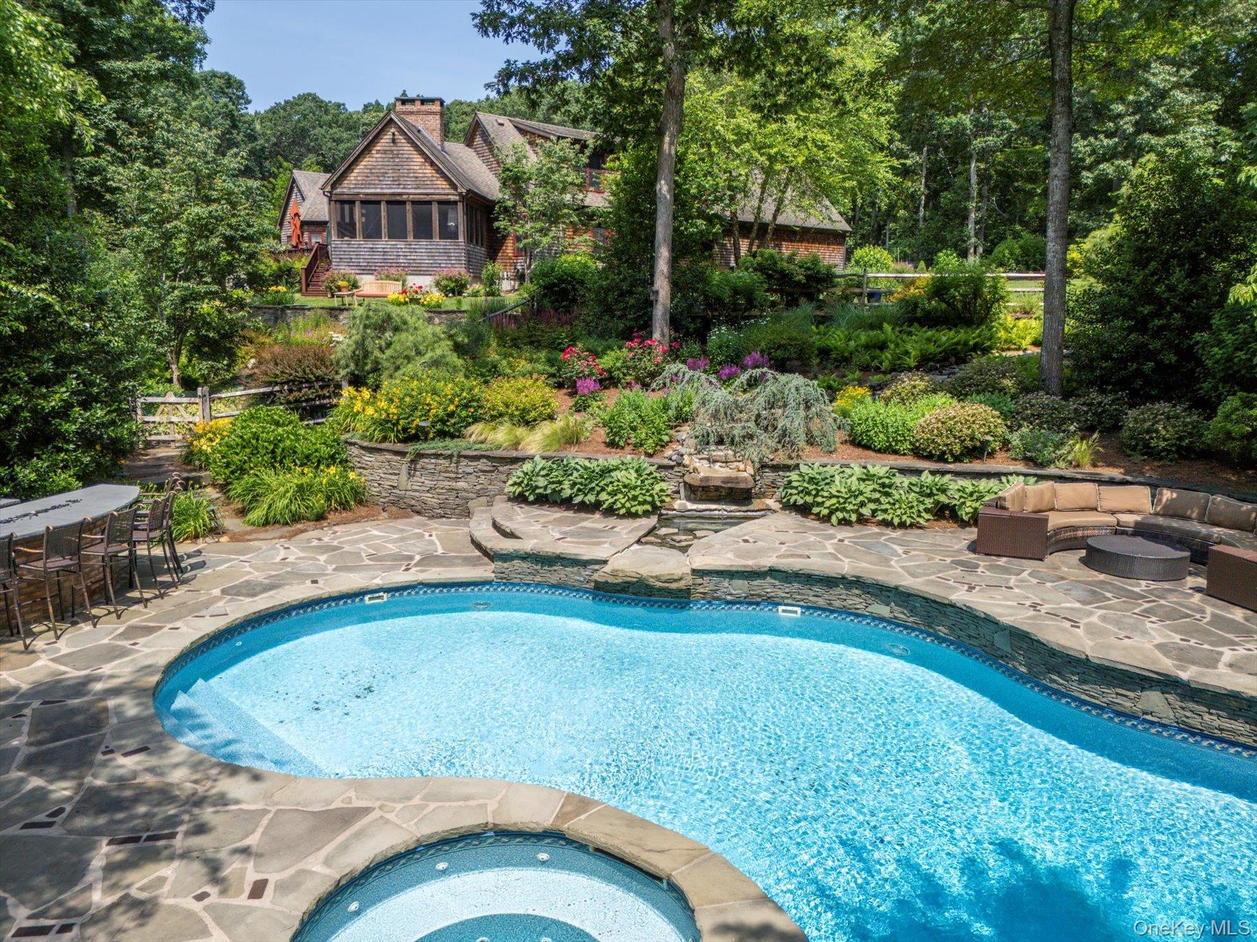 1750 Private Road, Unit 18 Mattituck, NY 11952 - Photo 36 of 49 a view of a swimming pool with a patio