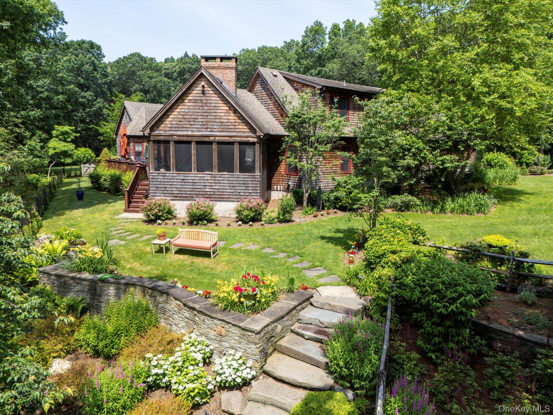 1750 Private Road, Unit 18 Mattituck, NY 11952 - Photo 37 of 49 a front view of house with yard and green space