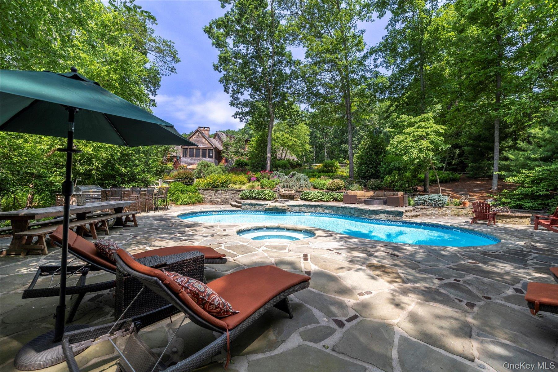 1750 Private Road, Unit 18 Mattituck, NY 11952 - Photo 39 of 49 a view of a swimming pool with a patio