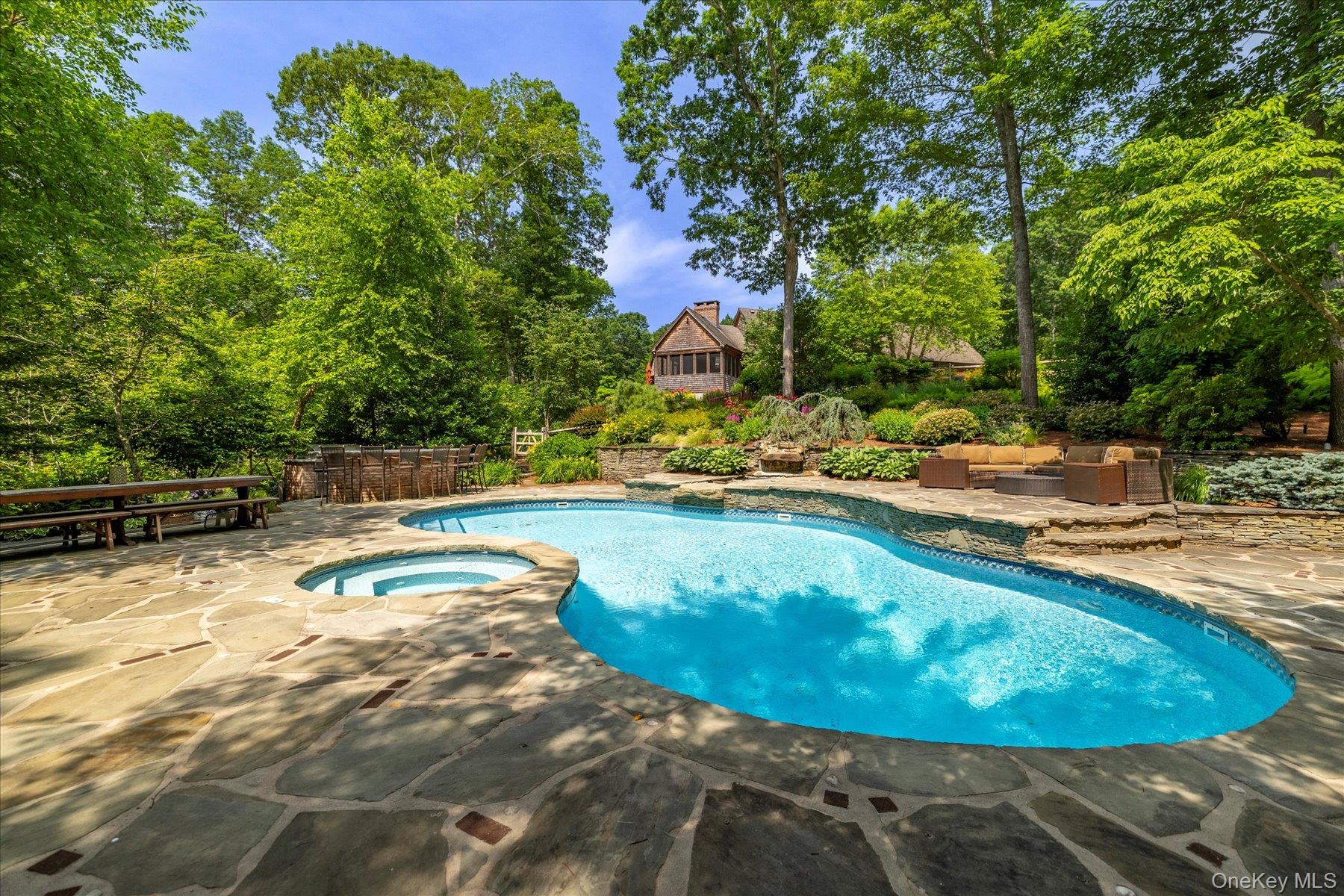 1750 Private Road, Unit 18 Mattituck, NY 11952 - Photo 40 of 49 a view of a swimming pool with a yard