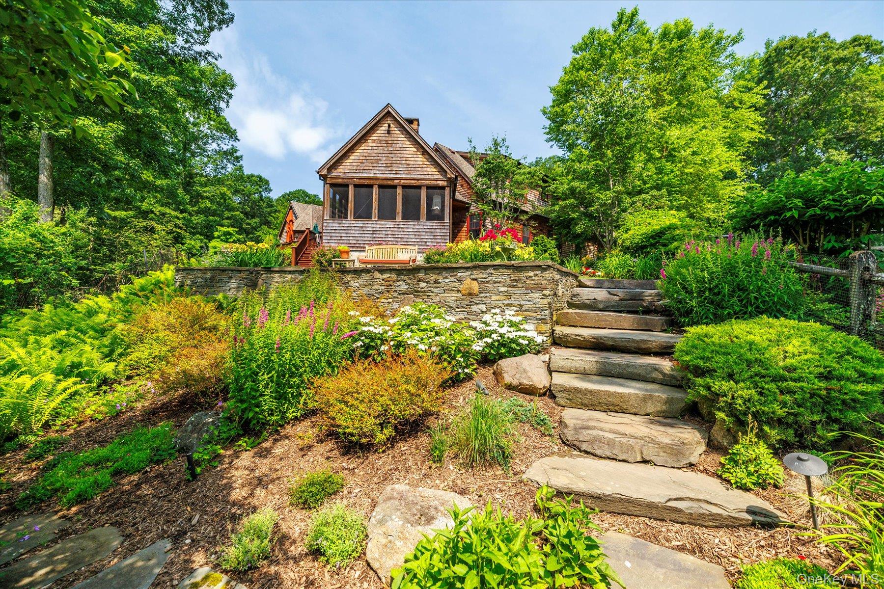 1750 Private Road, Unit 18 Mattituck, NY 11952 - Photo 43 of 49 a front view of a house with a yard