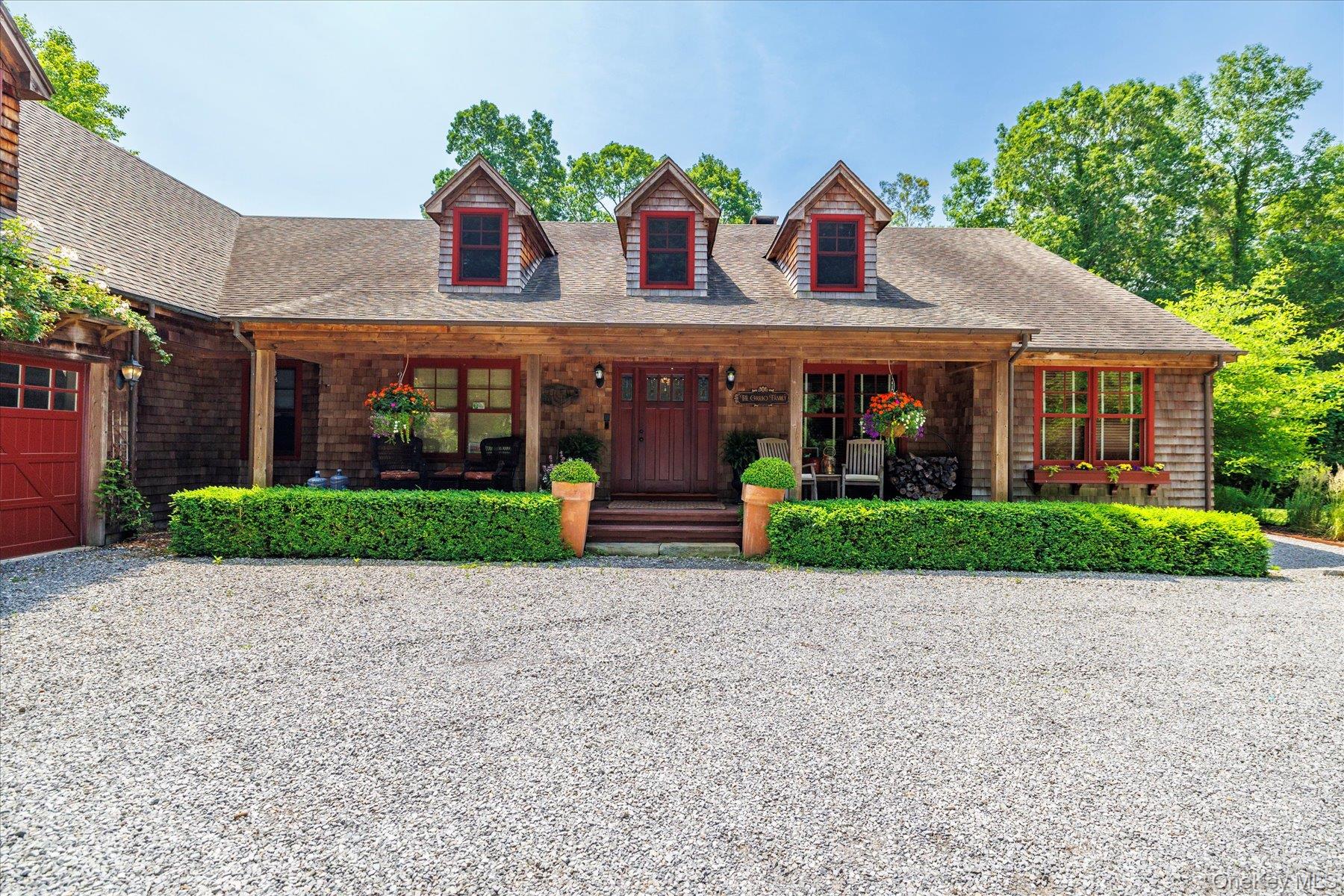 1750 Private Road, Unit 18 Mattituck, NY 11952 - Photo 5 of 49 a front view of house with yard and green space