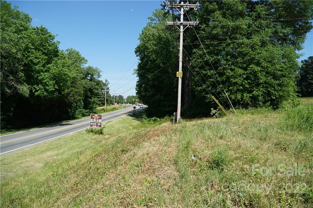 14809 Brown Mill Road Huntersville, NC 28078 - Photo 10 of 11 a backyard of a house with a swing and slide