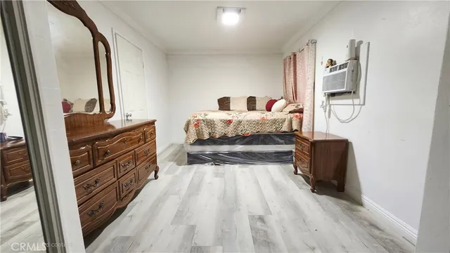 a bedroom with a bed and a mirror