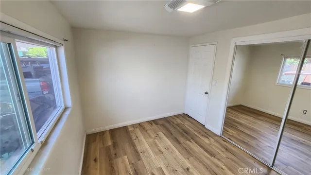a view of wooden floor in an empty room