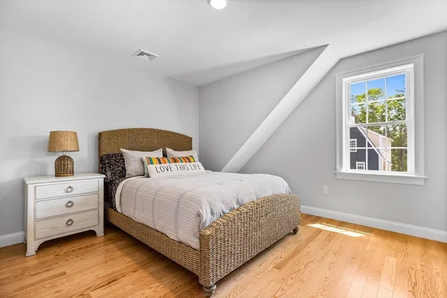 a bedroom with a bed and window