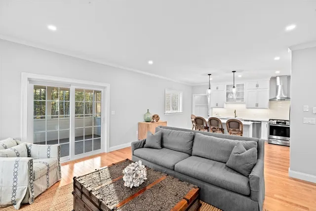 a large living room with furniture and a large window