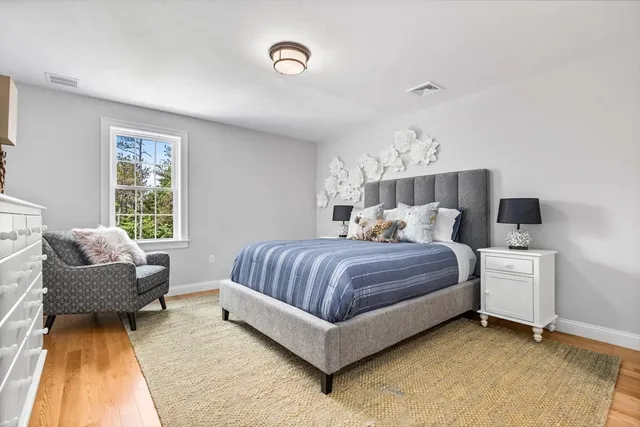 a bedroom with bed and window