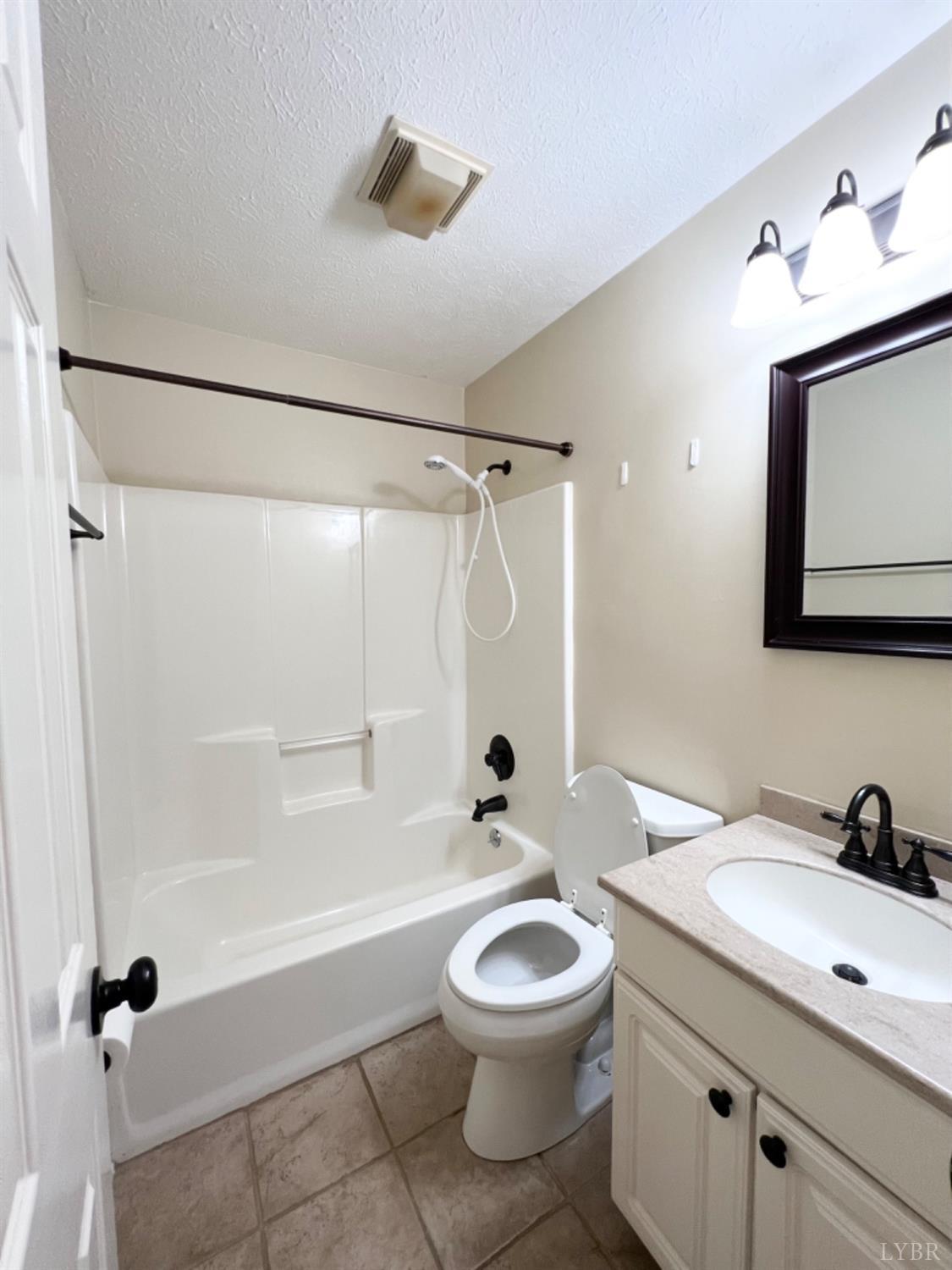 202 Sugar Mill Drive Amherst, VA 24521 - Photo 12 of 41 a bathroom with a granite countertop sink a toilet and shower