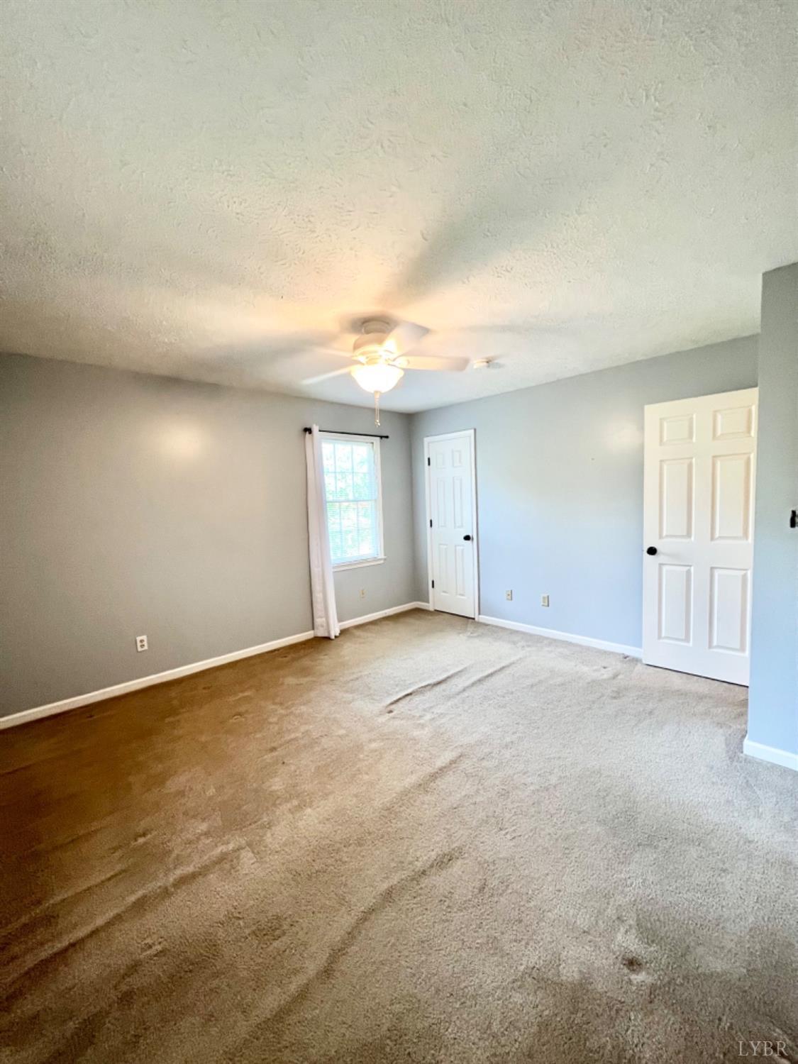 202 Sugar Mill Drive Amherst, VA 24521 - Photo 15 of 41 a view of an empty room with a window