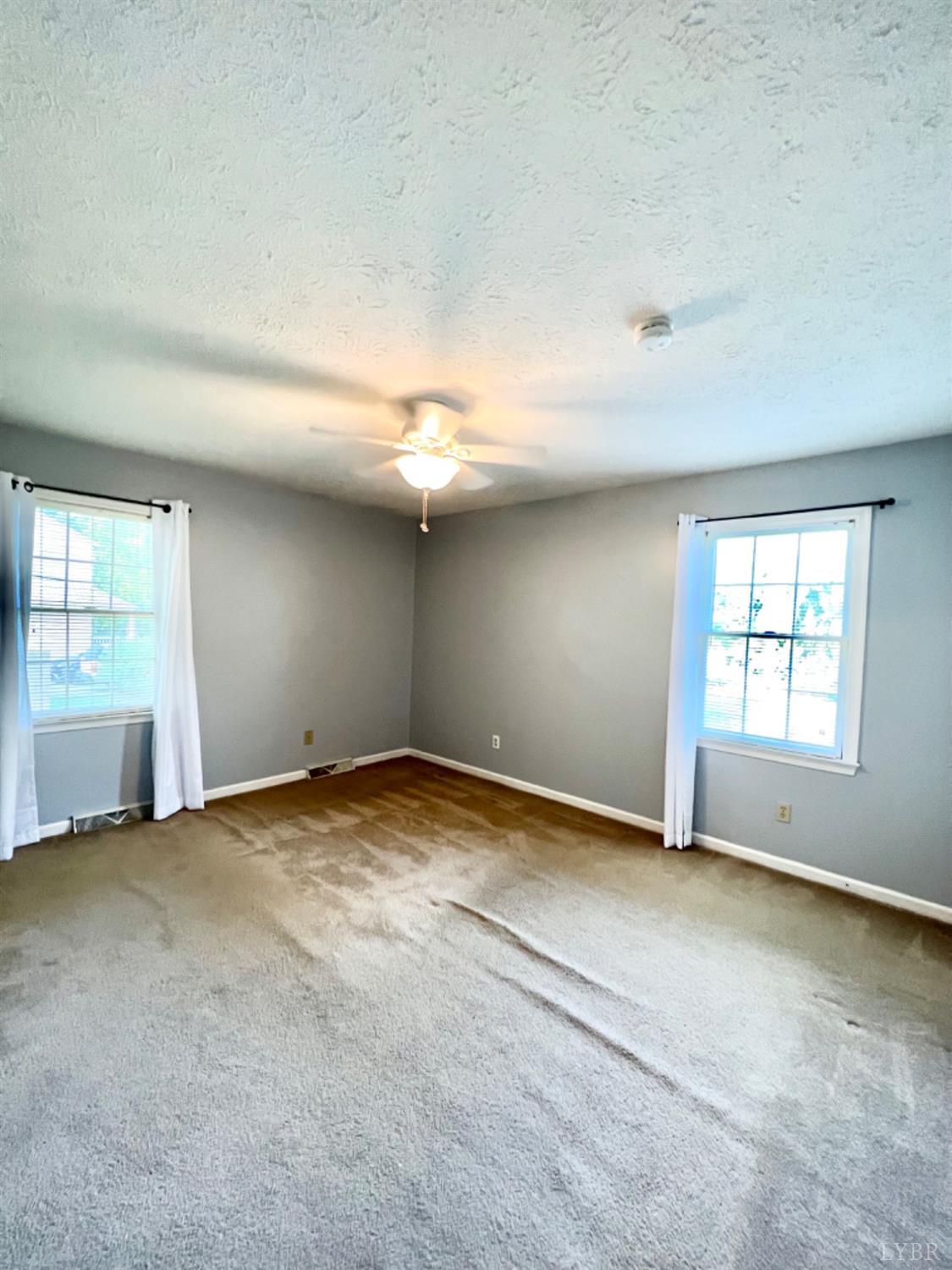 202 Sugar Mill Drive Amherst, VA 24521 - Photo 16 of 41 an empty room with windows