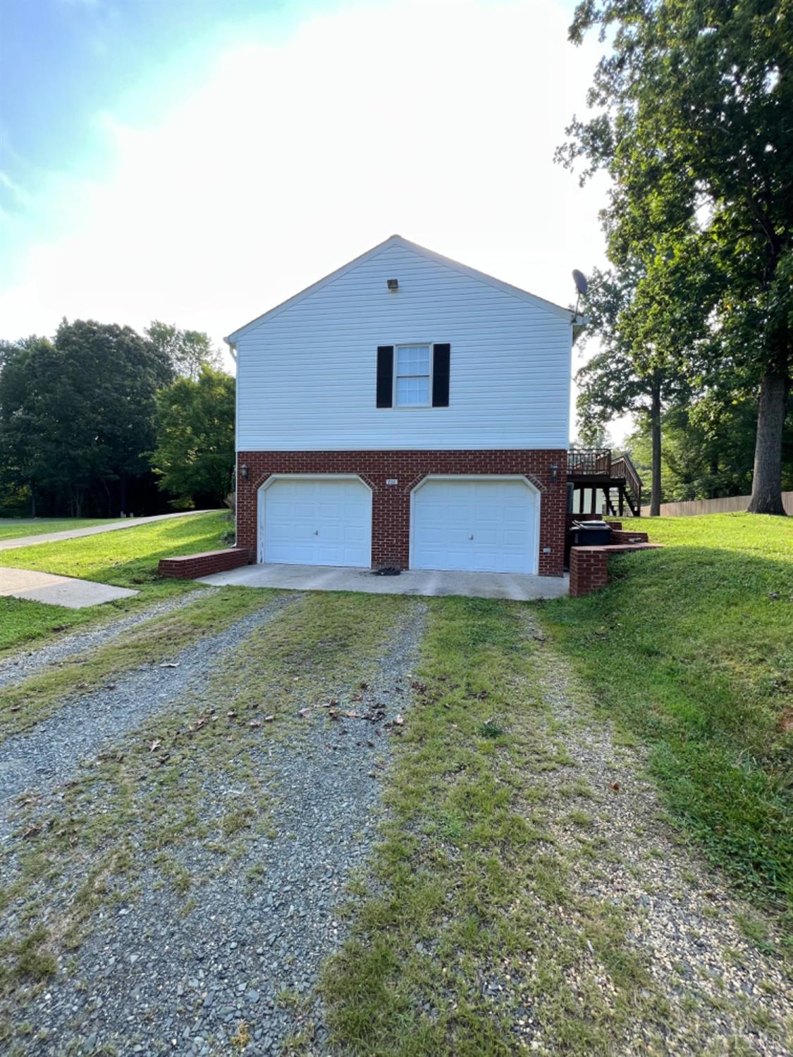 202 Sugar Mill Drive Amherst, VA 24521 - Photo 18 of 41 a front view of a house with garden