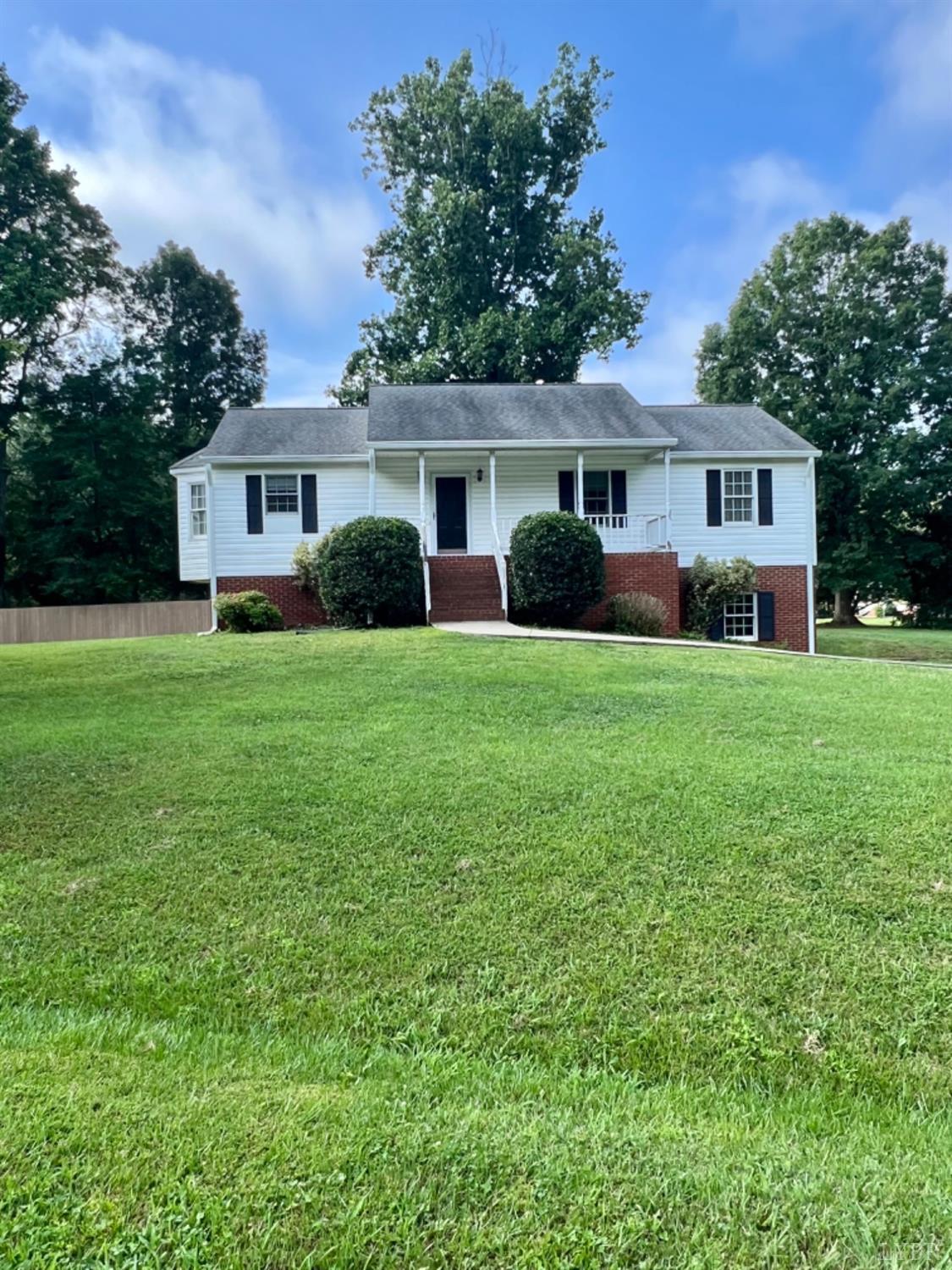 202 Sugar Mill Drive Amherst, VA 24521 - Photo 26 of 41 a front view of a house with a garden