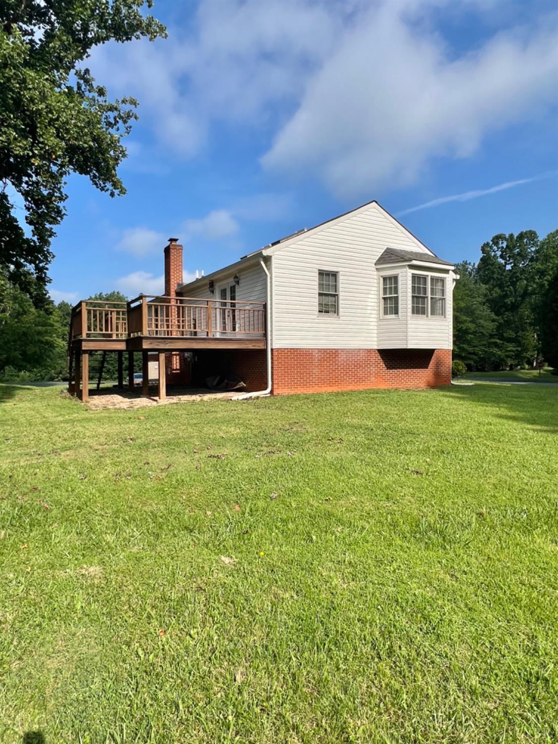 202 Sugar Mill Drive Amherst, VA 24521 - Photo 30 of 41 a front view of a house with a yard and garage