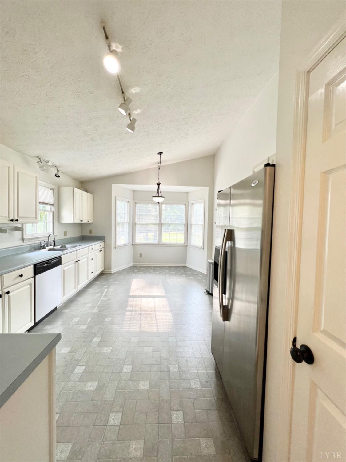 202 Sugar Mill Drive Amherst, VA 24521 - Photo 3 of 41 a kitchen with refrigerator and window