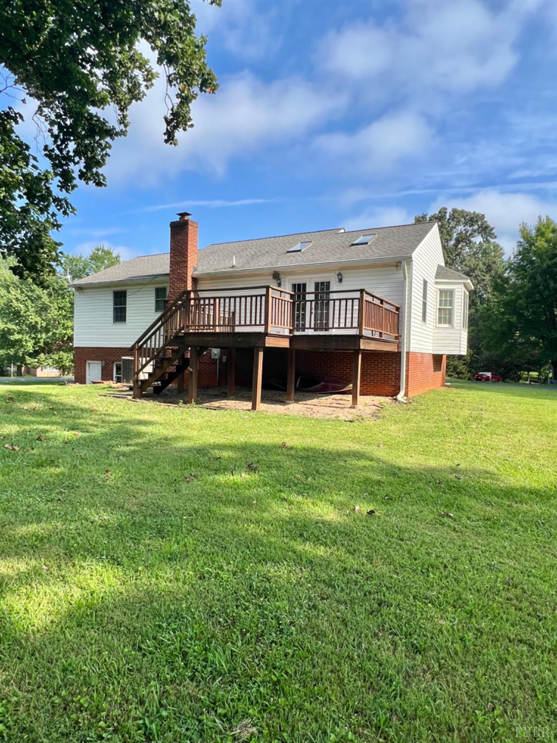 202 Sugar Mill Drive Amherst, VA 24521 - Photo 31 of 41 a view of house in front of a big yard with large trees
