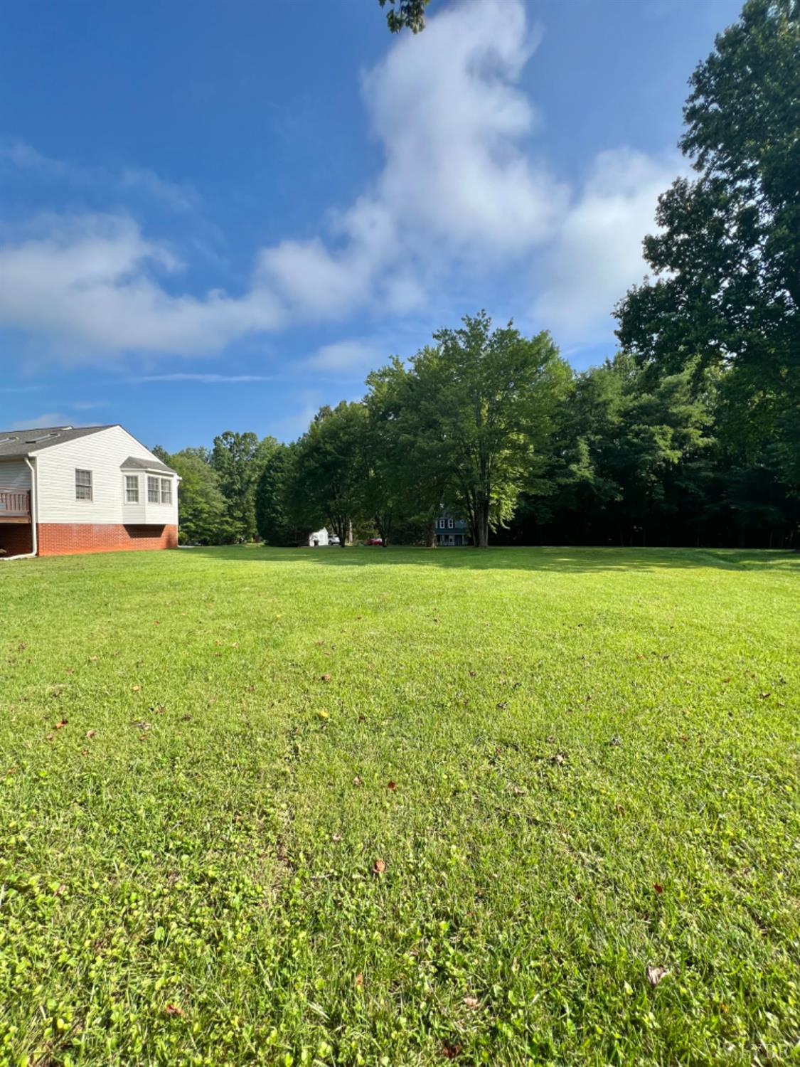 202 Sugar Mill Drive Amherst, VA 24521 - Photo 34 of 41 a view of a big yard with a house in the background