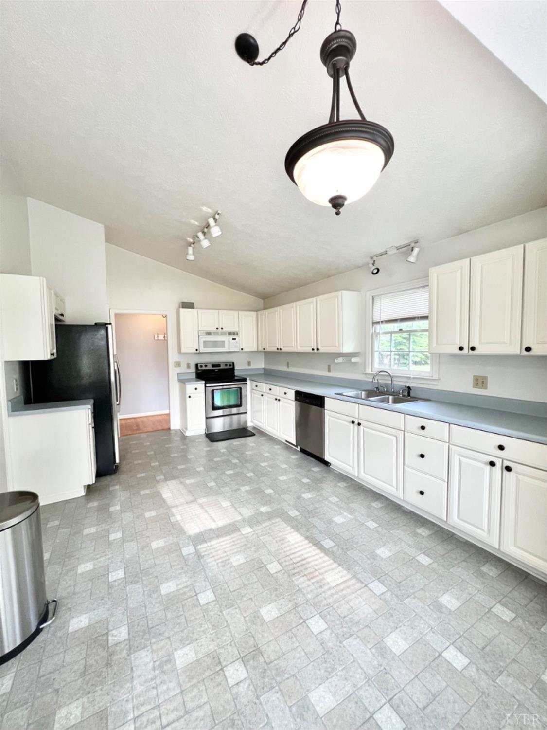 202 Sugar Mill Drive Amherst, VA 24521 - Photo 4 of 41 a large kitchen with cabinets