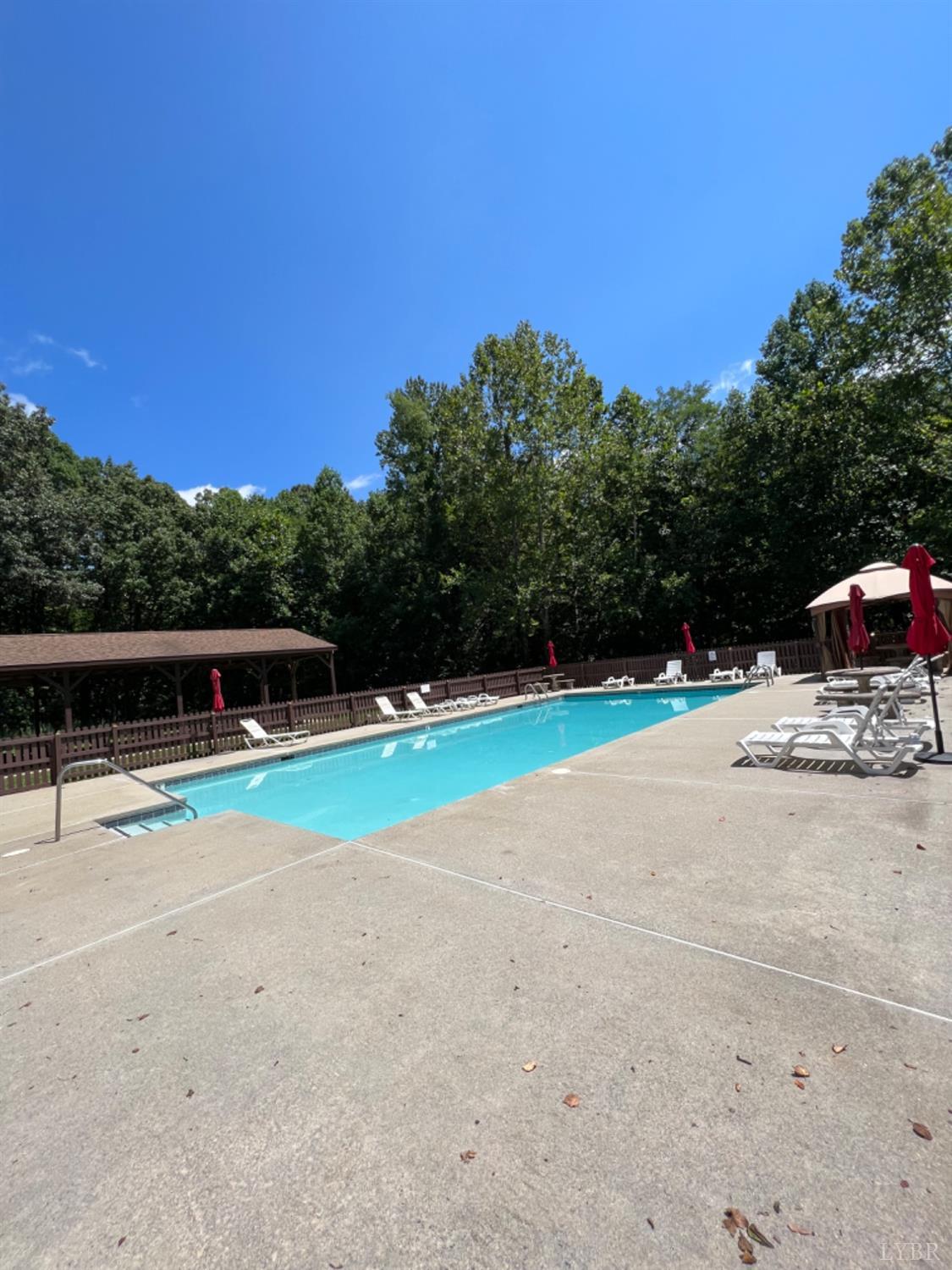 202 Sugar Mill Drive Amherst, VA 24521 - Photo 41 of 41 a view of outdoor space with swimming pool and trees in the background