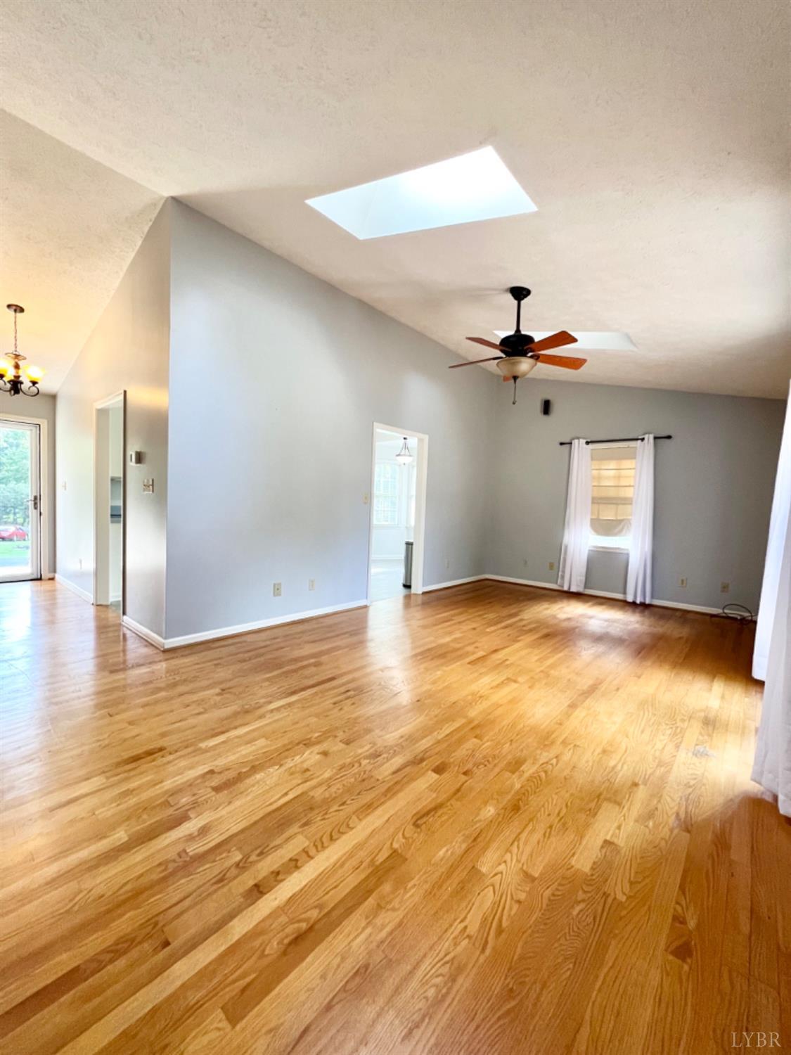 202 Sugar Mill Drive Amherst, VA 24521 - Photo 9 of 41 a view of empty room with wooden floor