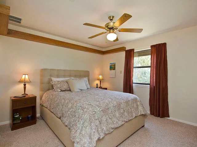 a bathroom with a double vanity sink and mirror