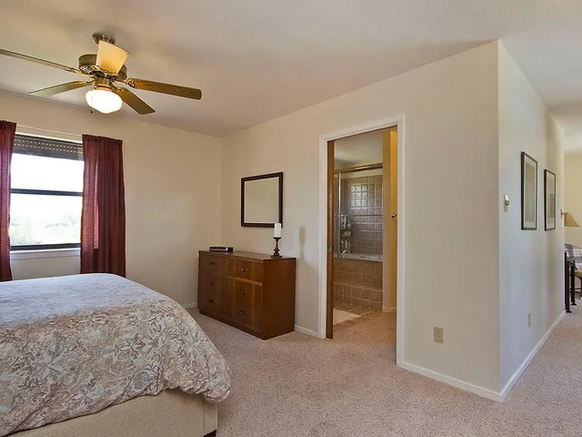 a bathroom with a shower and a sink