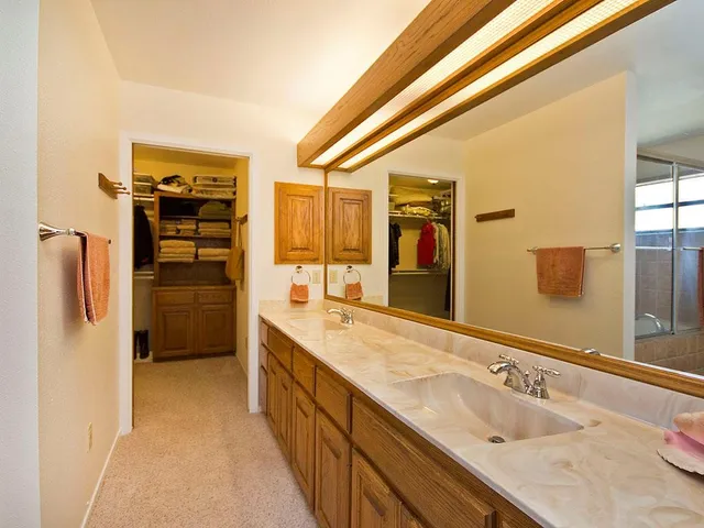 a view of a livingroom with furniture and a flat screen tv