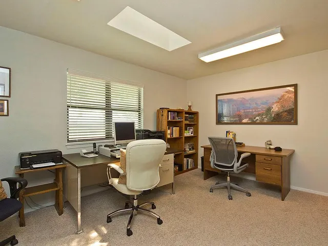 a view of a house with swimming pool and a yard