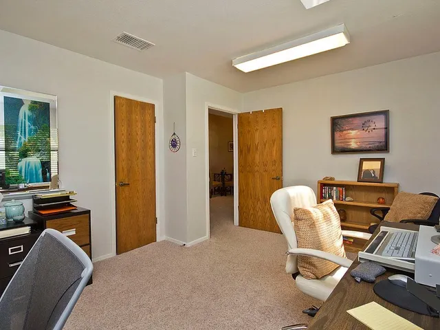 a view of a house with swimming pool and a yard