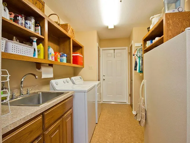 a view of a house with a yard and a pool