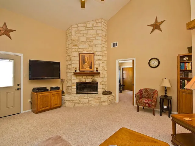 a view of a dining room with furniture and a kitchen