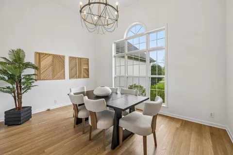 a kitchen with a white stove top oven and white cabinets
