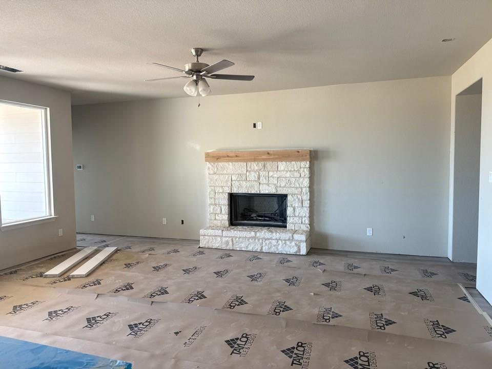 1201 Colca Drive Springtown, TX 76082 - Photo 5 of 9 a view of a livingroom with a fireplace