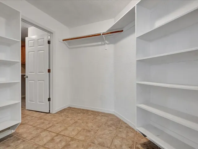 a bathroom with a sink toilet and mirror