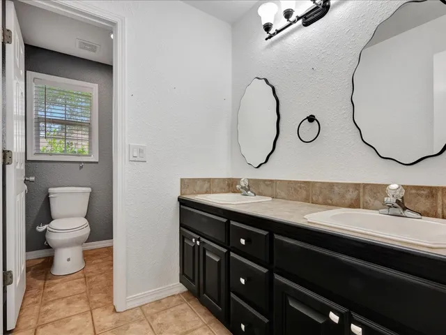 an aerial view of a house with a swimming pool