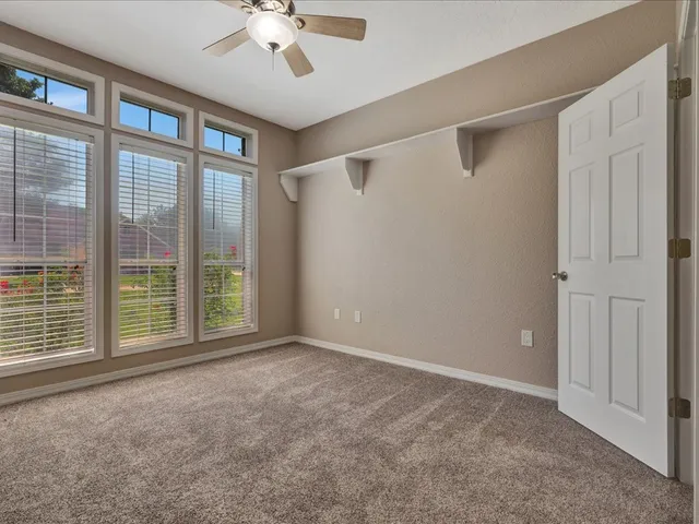 an aerial view of a house with swimming pool and porch