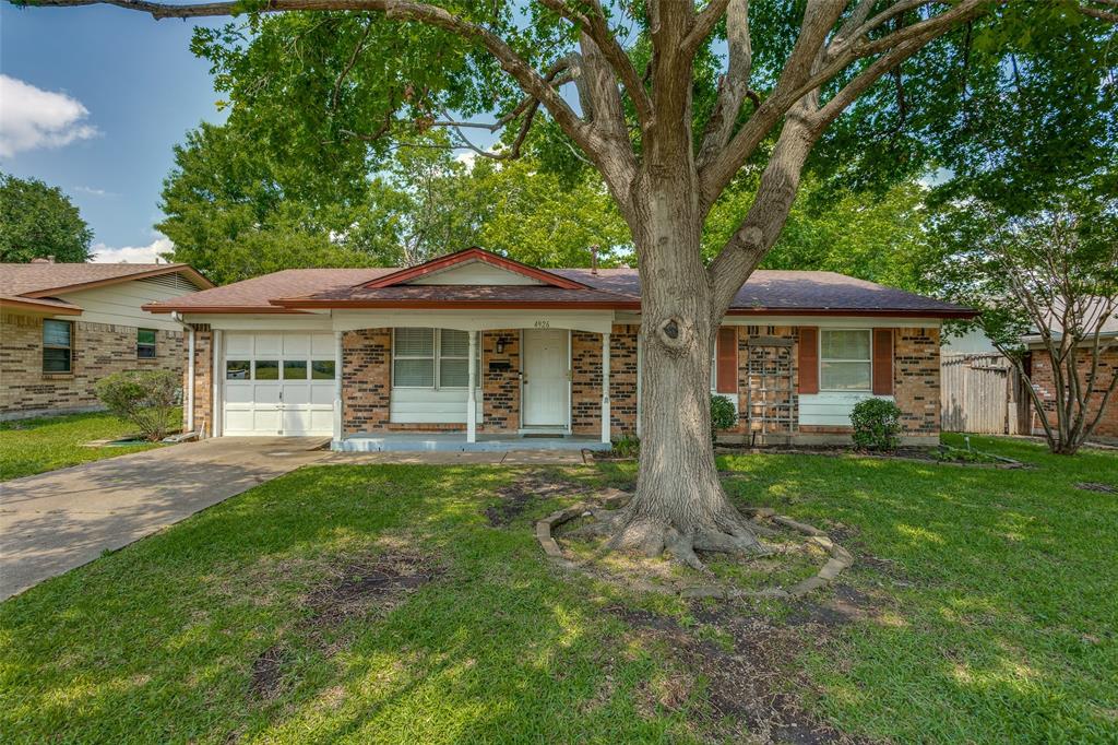 4926 Pinehurst Drive Garland, TX 75043 - Photo 1 of 1 a front view of a house with yard patio and green space