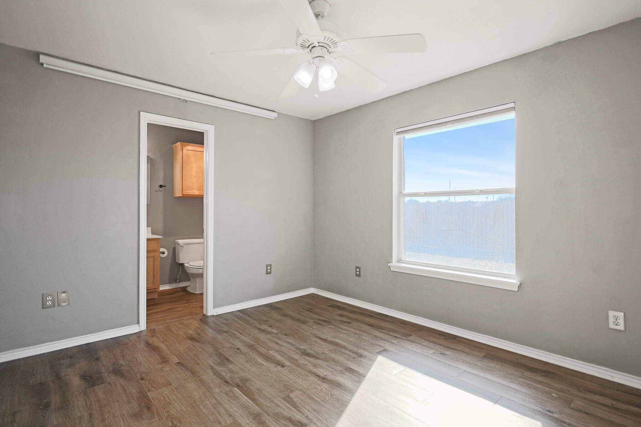 5903 10th Street, Unit 2 Lubbock, TX 79416 - Photo 22 of 47 an empty room with windows and closet