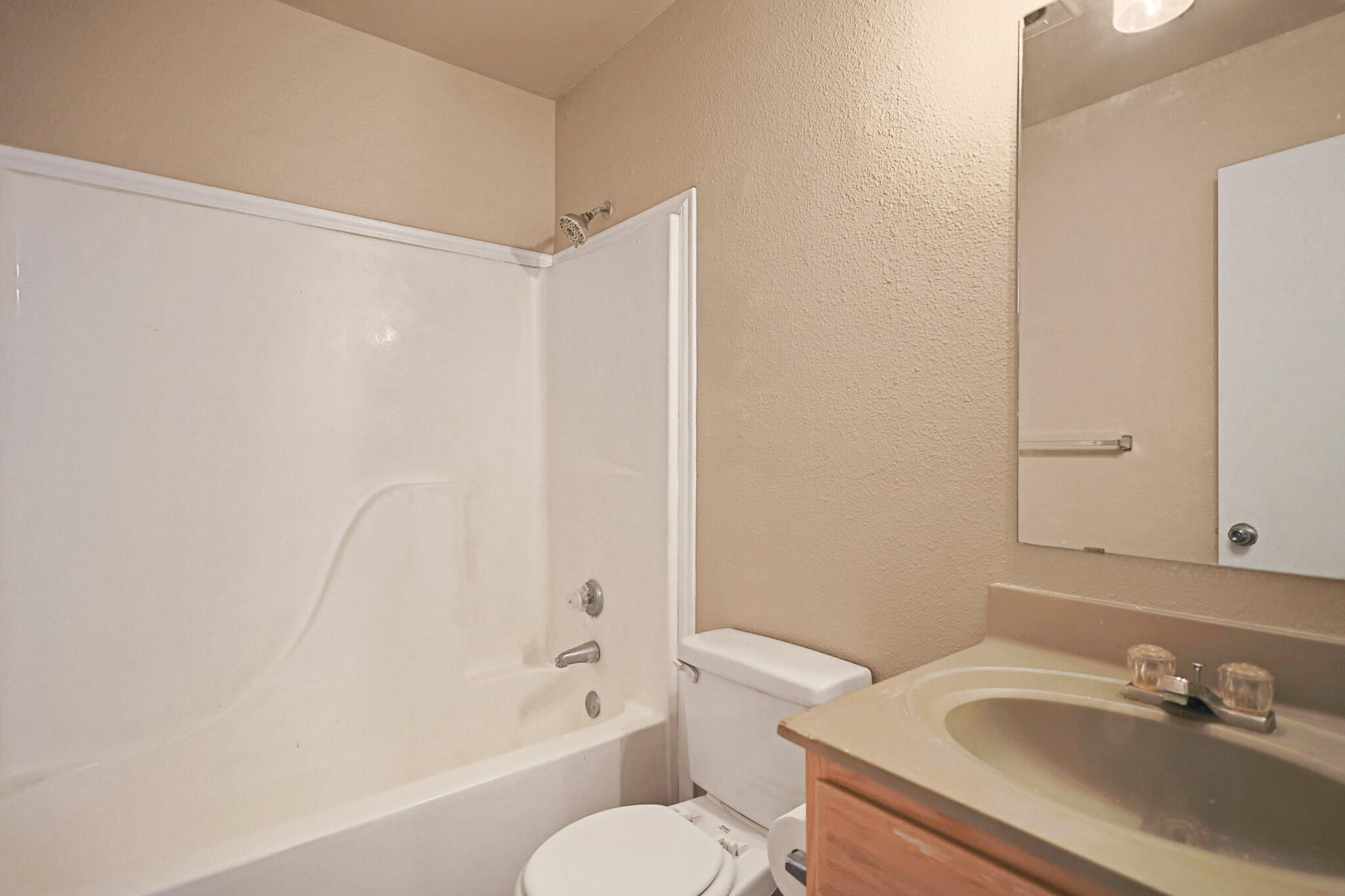 5903 10th Street, Unit 2 Lubbock, TX 79416 - Photo 31 of 47 a bathroom with a sink toilet and shower