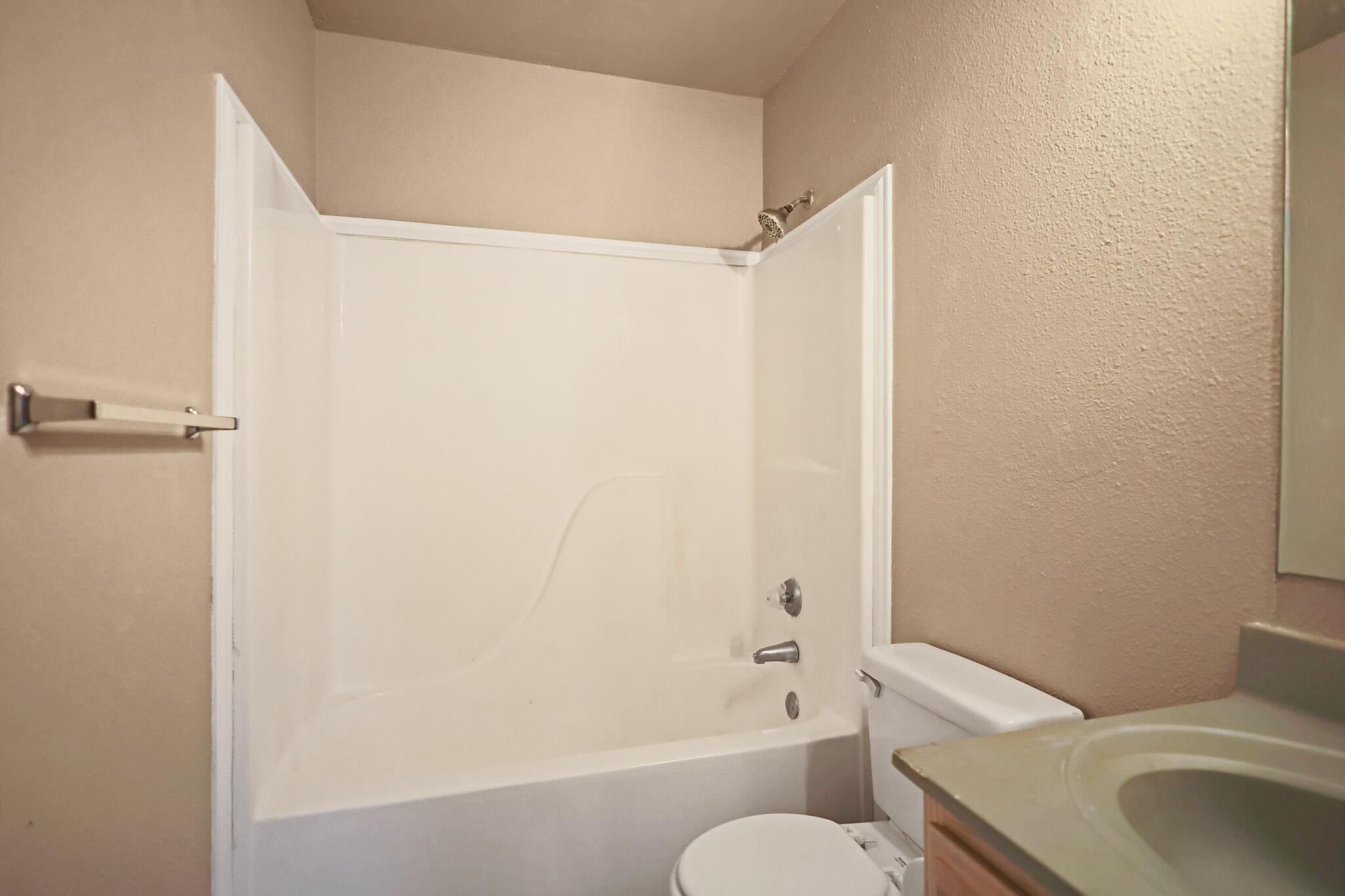 5903 10th Street, Unit 2 Lubbock, TX 79416 - Photo 32 of 47 a bathroom with a toilet and a shower