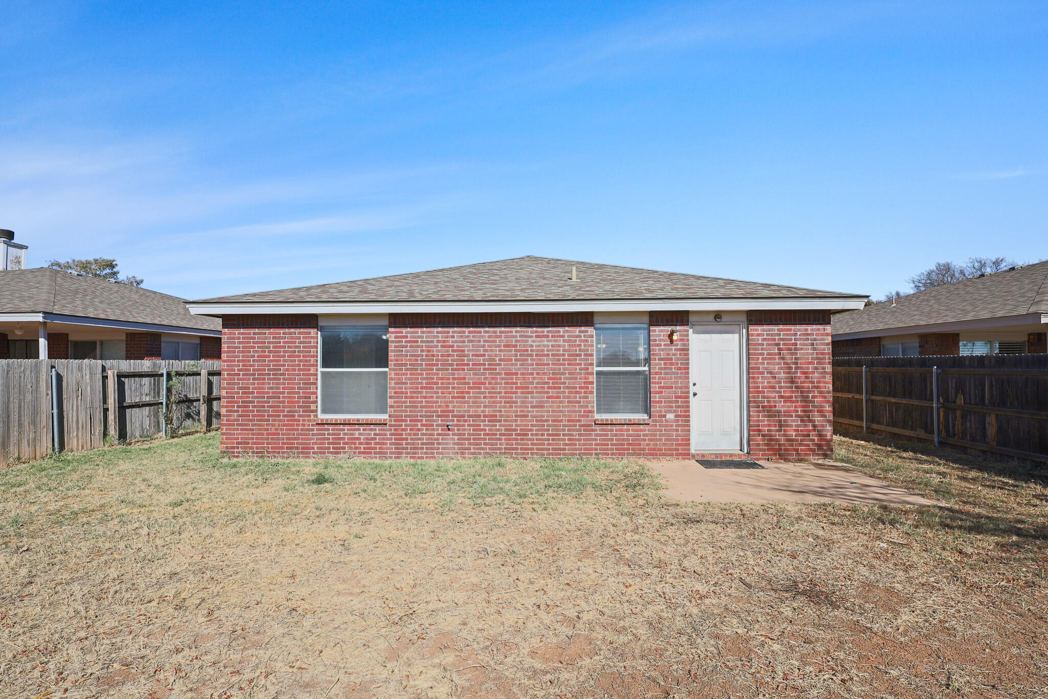 5903 10th Street, Unit 2 Lubbock, TX 79416 - Photo 40 of 47 front view of a house with a yard