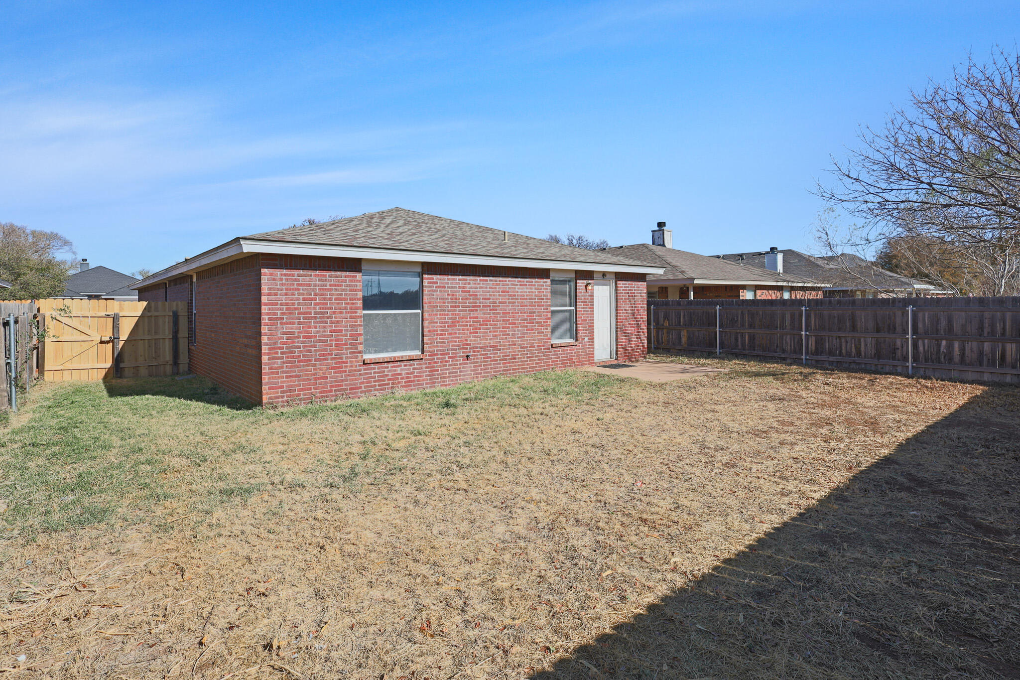 5903 10th Street, Unit 2 Lubbock, TX 79416 - Photo 41 of 47 a front view of a house with a garden