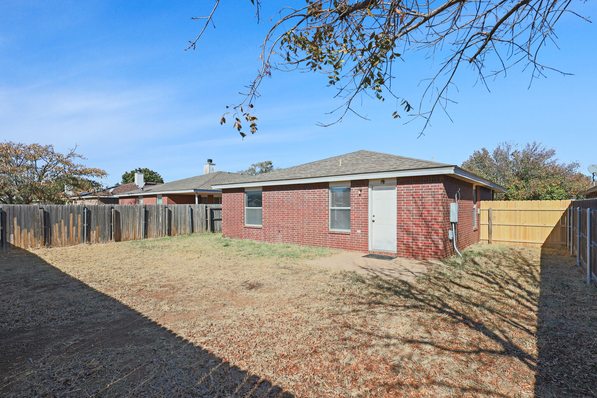 5903 10th Street, Unit 2 Lubbock, TX 79416 - Photo 42 of 47 a front view of a house with a yard
