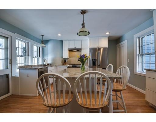 72 Main Street Framingham, MA 01702 - Photo 14 of 28 a dining room with furniture a chandelier and wooden floor
