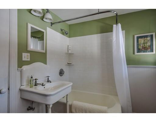 72 Main Street Framingham, MA 01702 - Photo 17 of 28 a bathroom with a sink and mirror