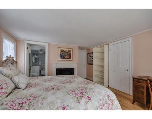 72 Main Street Framingham, MA 01702 - Photo 19 of 28 a bedroom with a bed and a television