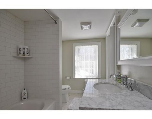 72 Main Street Framingham, MA 01702 - Photo 22 of 28 a bathroom with a sink and a mirror