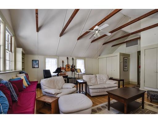 72 Main Street Framingham, MA 01702 - Photo 26 of 28 a living room with furniture a ceiling fan and a window