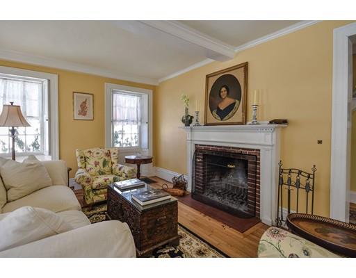 72 Main Street Framingham, MA 01702 - Photo 5 of 28 a living room with furniture a window and a fireplace